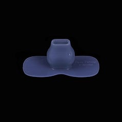 This a blue hat shaped mouth piece made of flexible silicone. It is centrally placed on a square black background. 