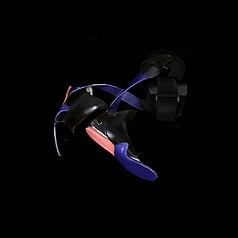 Blue, red and black assistive feet orthotics made for running. Centrally positioned on a square black background. 