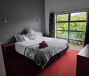Spacious master bedroom of 14 Cologne Street with view of garden