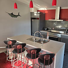 The grey and white kitchen and island bench at 14 Cologne Street