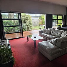 Lounge area of 14 Cologne St with backyard in the background