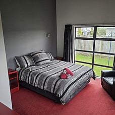 Spacious bedroom of 14 Cologne Street with view into backyard