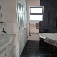 Large bathroom with bathtub