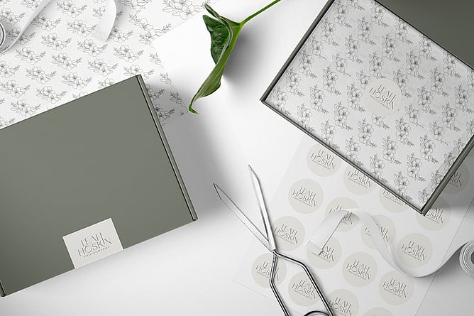 Image of Leah Hoskin Photography's branding on packaging. Image for "Why does my brand need logo variations" blog post. Creative Box, New Zealand.