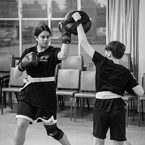 Kickboxer doing a side turning kick