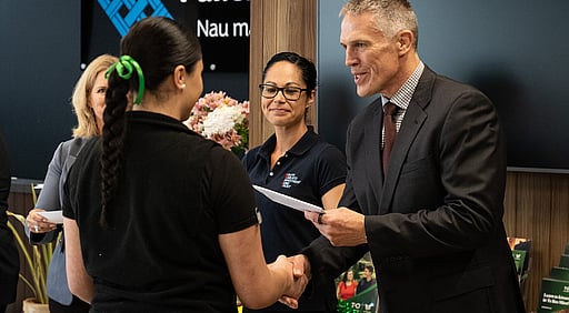 A scholarship recipient being awarded