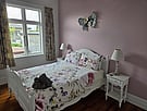 One of the five generous bedrooms at Villa Rosa
