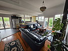 Living room area with kitchen in background