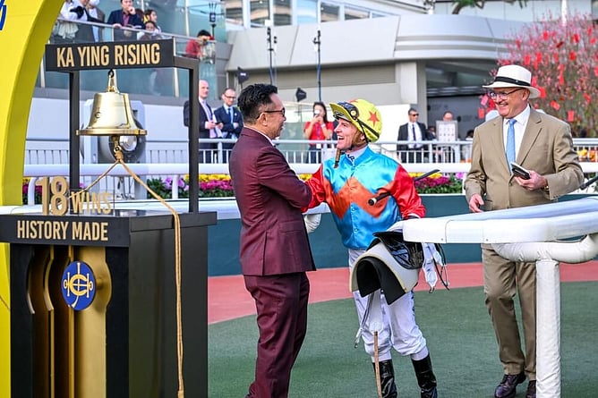Zac Purton and David Hayes celebrate with Leung Shek Kong of the Ka Ying Syndicate. - Photo: Hong Kong Jockey Club