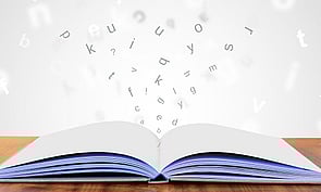 Book with words jumping off page. 