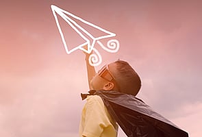 Young boy dressed as super hero 