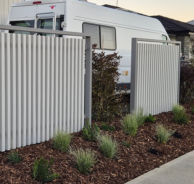 Modern vertical slat fence installed by Sherlock Landscaping in Nelson &mdash; contemporary outdoor boundary design with clean lines and durable construction