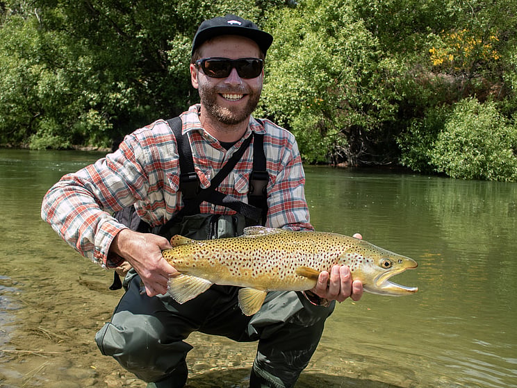Alex with his first fish on the fly! 6.75 pounds of golden brown trout. Todd Adolph 