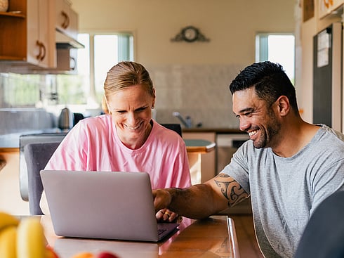 Couple reviewing mortgage options at home.