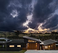 Rangitahi Peninsula house exterior at sunset