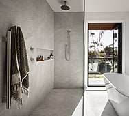 Bathroom interior detail — flush hidden bathroom door, seamless design, Nixon Homes build