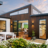 Outdoor dining area with pergola — relaxed weekend living, Raglan home