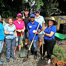 Rotarians posing for a photo after a garden clean up