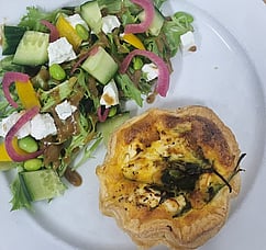 Our savoury quiche. Side salad dressed with a balsamic vinaigrette.  