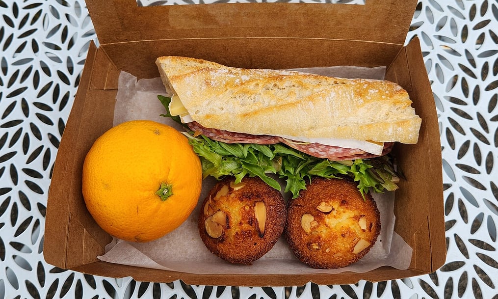 Our Take away option offering financiers, a filled roll and a piece of fruit