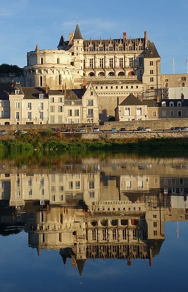 Castle Amboise reflected in the Loire River in the late afternoon.