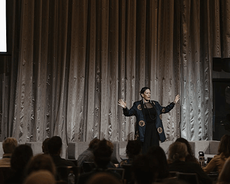 Anah Aikman inspiring audiences as an international speaker, delivering transformative insights on cultural change, mindful leadership, and Indigenous wellbeing at a packed event.