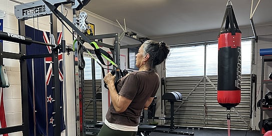 Anah Aikman training in a gym to prepare for the Te Araroa Trail, showcasing her journey of resilience and exploration across the stunning landscapes of New Zealand.