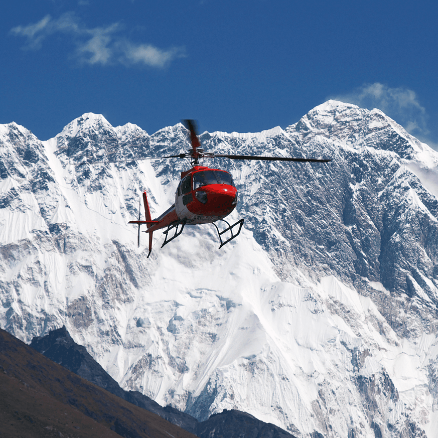 Helicopter flying with snowy Southern Alps in the background