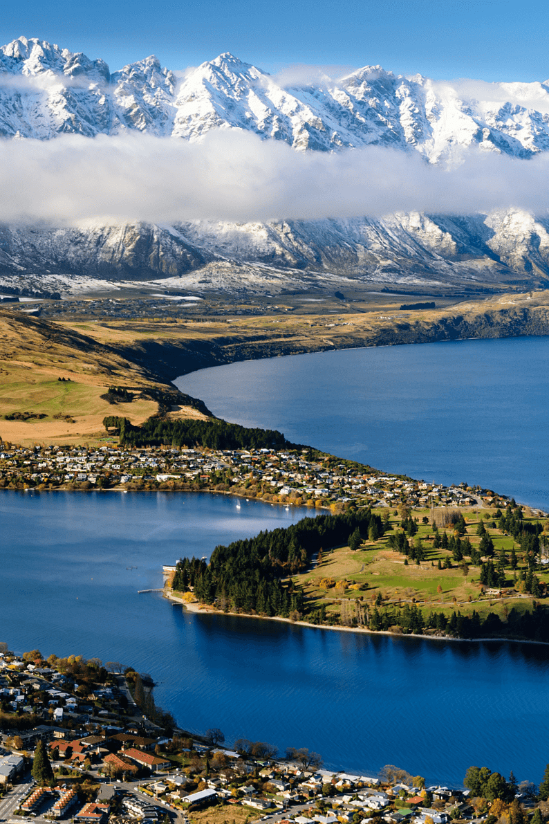 Stunning view of Lake Wakatipu and the snow-capped Remarkables mountain range in Queenstown, New Zealand.
