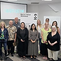 Group of professionals attending a sustainability and social impact workshop