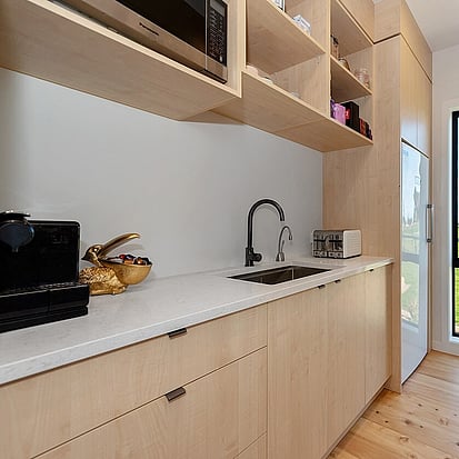 Image of modern tiled butlers kitchen. Tiling service by Cosmic Tiling for Waikato Build. Waikato.
