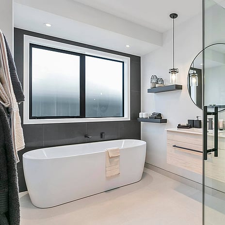 Image of modern tiled bathroom. Tiling service by Cosmic Tiling for A1 Homes. Waikato.