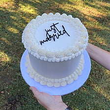 Gluten free child's birthday cake in red blue and yellow with the name Max and a figurine on top Roblox theme
