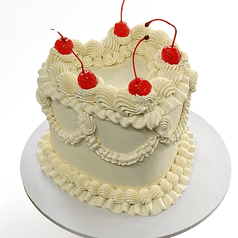 Gluten-free decorative unicorn cake with rainbow mane pink ears and gold horn