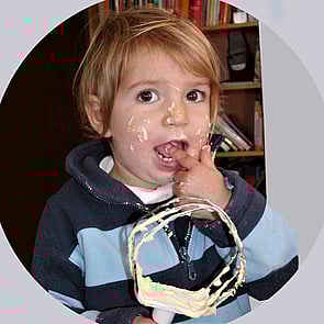 Sabine's daughter as a toddler licking the beater after baking