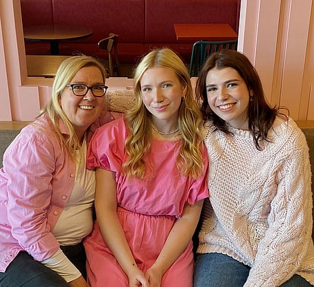 Sabine and her daughter standing in front of their gluten free trailer kitchen.