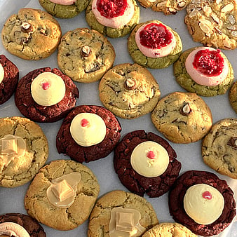 Photo of shiny chocolate icing cookies with caramel squiggly icing