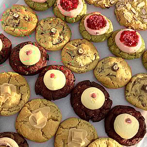 Photo of shiny chocolate icing cookies with caramel squiggly icing