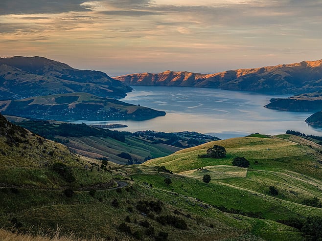 Banks Peninsula hills and Akaroa Harbour at sunset