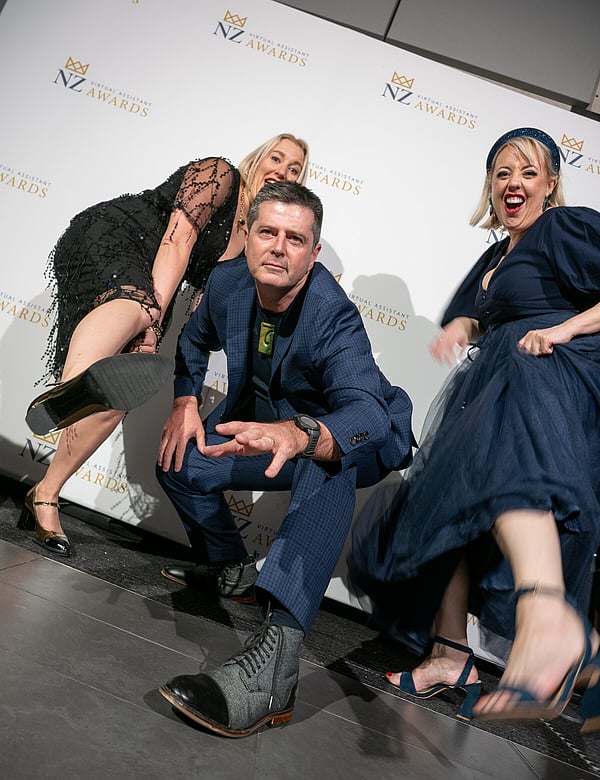 Event guests posing in front of the media wall at the NZ Virtual Assistant Awards in Hamilton, New Zealand.