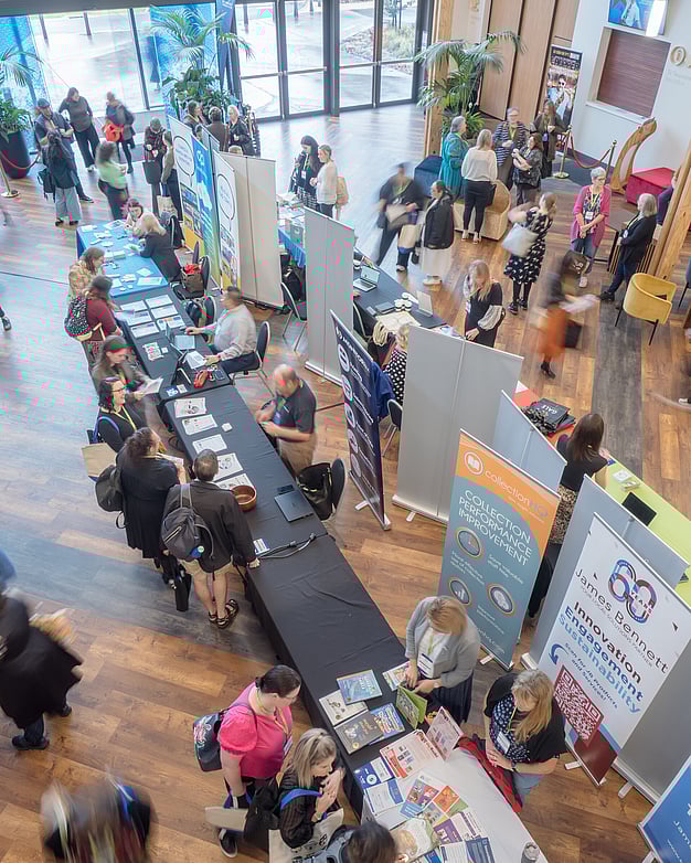 Photo of Public Libraries NZ Forum event in Rotorua showing a birdseye view of the trade show stalls.