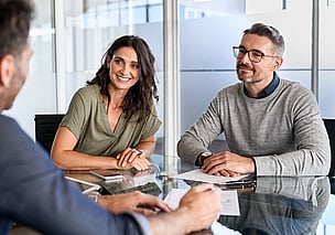 Smiling couple in meeting 