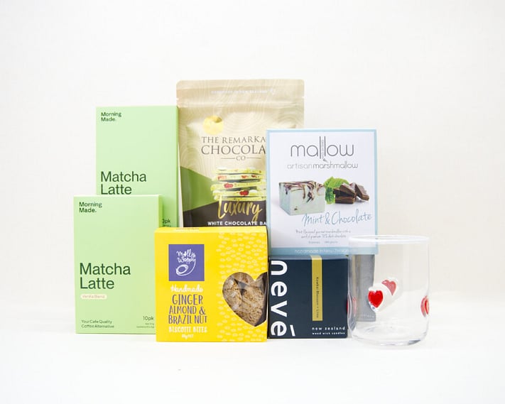 The Matcha Gift Box featuring Morning Made matcha, Molly Woppy biscotti, Nevé candle, HomeLab glassware, Great Day Mallow marshmallows, and Remarkable Chocolate in a premium KYND gift box.