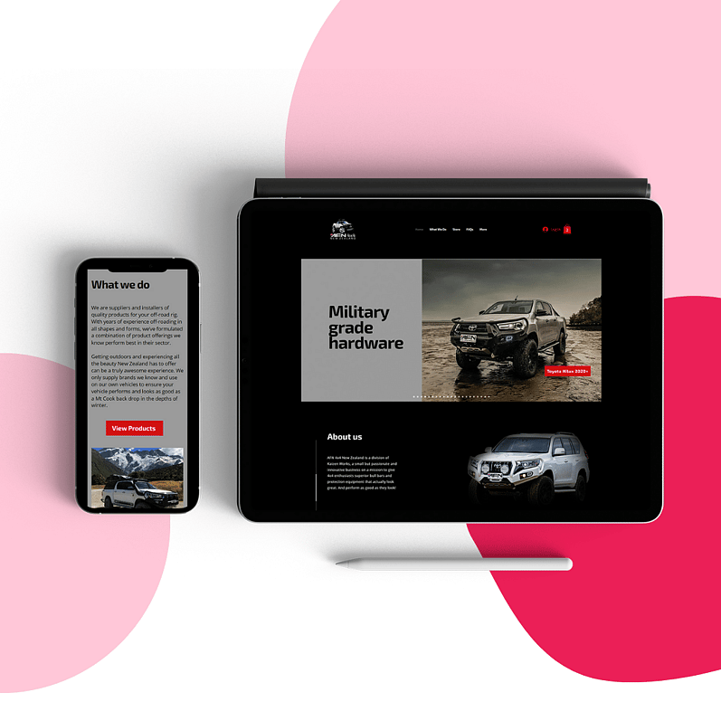 Mobile phone and tablet displaying a website with black, grey, and red colours, showcasing military-grade hardware and 4x4 vehicles
