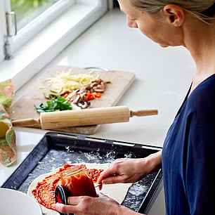 Editorial photography for Living Lightly book by Nicola Turner making pizza