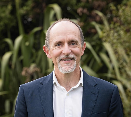 A head and shoulders photograph of Roger Robson-Williams