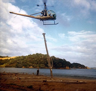 Smythe Contractors &ndash; Helicoptering power poles on islands