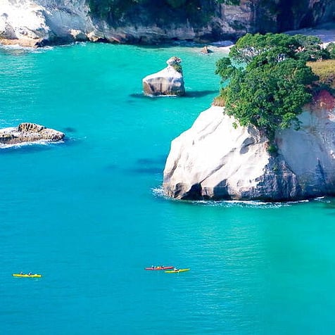 Kayakers in the water at Cathedral Cove.