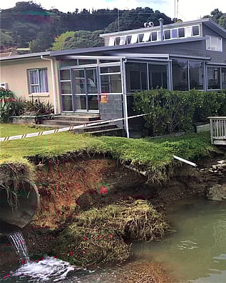 Chunks of the river bank eroded away behind the Kuaotunu Fire Station on the Coromandel Peninsula