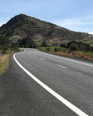 SH25 curving up Myndermans Hill in Kuaotunu on the Coromandel Peninsula
